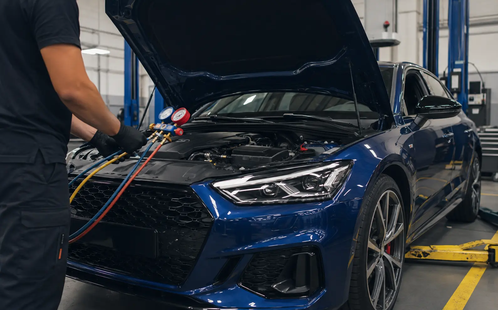 Blue performance car AC testing in Dubai workshop
