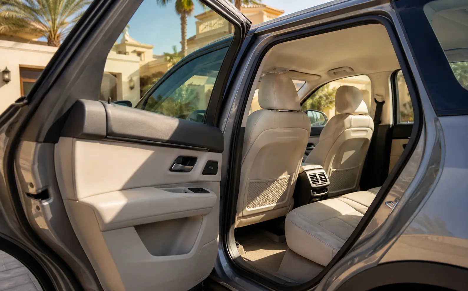 Sunlit family SUV rear cabin after outdoor parking in Jumeirah